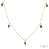 5x3 MM Oval Shape Emerald and 1/8 Ctw Round Cut Diamonds Precious Station Necklace in 10K Yellow Gold