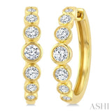 1 1/10 Ctw Graduated Bezel Set Round Cut Diamond Fashion Hoop Earrings in 14K Yellow Gold