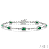 5x3 MM Oval Cut Emerald and 1/20 Ctw Single Cut Diamond Bracelet in 10K White Gold