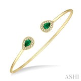 1/5 Ctw Pear Shape 6x4 MM Emerald & Round Cut Diamond Precious Flexi Bangle in 14K Yellow Gold